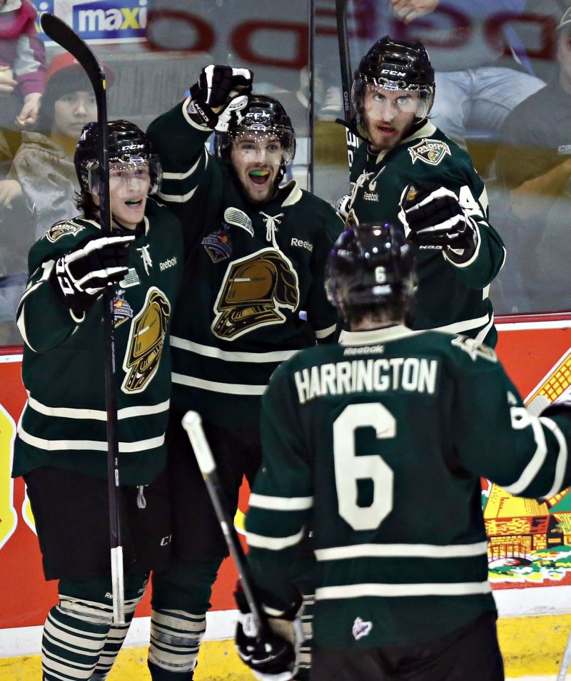 London, Ont. - Tyler Ferry, Seth Griffith, Jarrod Tinordi and Scott Harrington celebrate a London goal during the 2011-12 season.