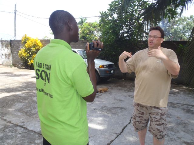 Barry Acton mentoring Issac Freeman, Power TV camera operator.