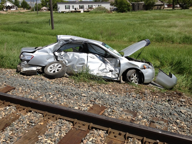 Priest dies from injuries after his vehicle struck by train near ...
