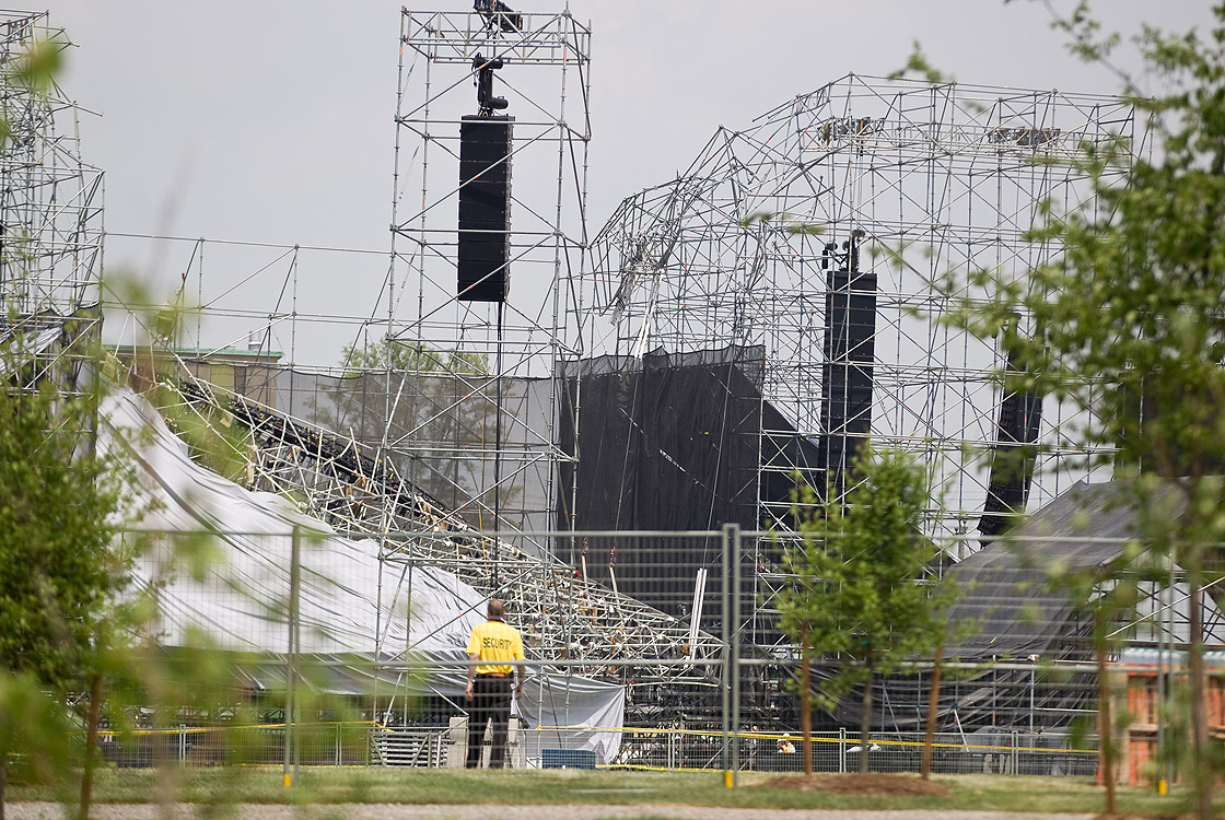Investigators survey the scene at Downsview Park in Toronto, Ontario, June 18, 2012, following Saturday's stage collapse just before a Radiohead concert, which left one man dead and 3 others injured.