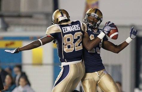 Blue Bombers wide receiver Chris Matthews celebrates a touchdown with Terrence Edwards.