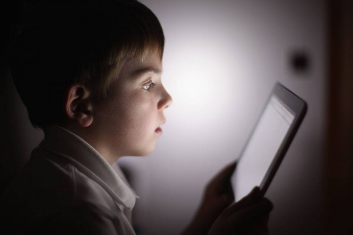 It may be tempting to hand mobile technology to a child who is acting up, according to a new study, some parents are more tempted than others.