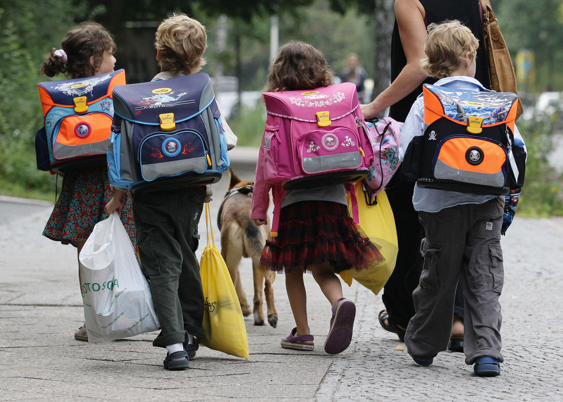 Children walk down the way on the first school day on August 23, 2010 in Berlin, Germany. Many German school districts, including those in Berlin, are reducing the school times pan from 13 to 12 years as part of a nationwide set of primary and secondary school reforms.