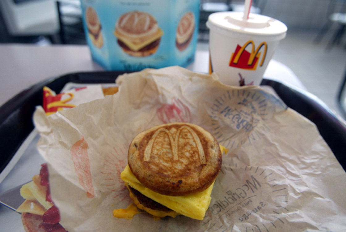 A cheese;sausage and egg McGriddles breakfast sandwich at a McDonald's is shown June 12;2003 in Coral Gables;Florida. The new McGriddles breakfast sandwiches are made to eat between pancakes;with maple syrup baked right in;and different combinations of sausage;crispy bacon;fluffy eggs and melted cheese in a sandwich.