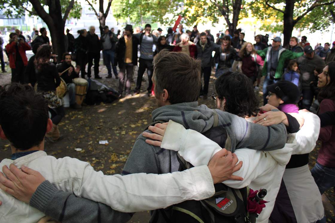 Demonstrators gather at Victoria Square in Montreal on October 15, 2011 as they join a worldwide movement. Protesters launched worldwide street demonstrations against corporate greed and biting cubacks in a rolling action targeting 950 cities in 82 countries. 