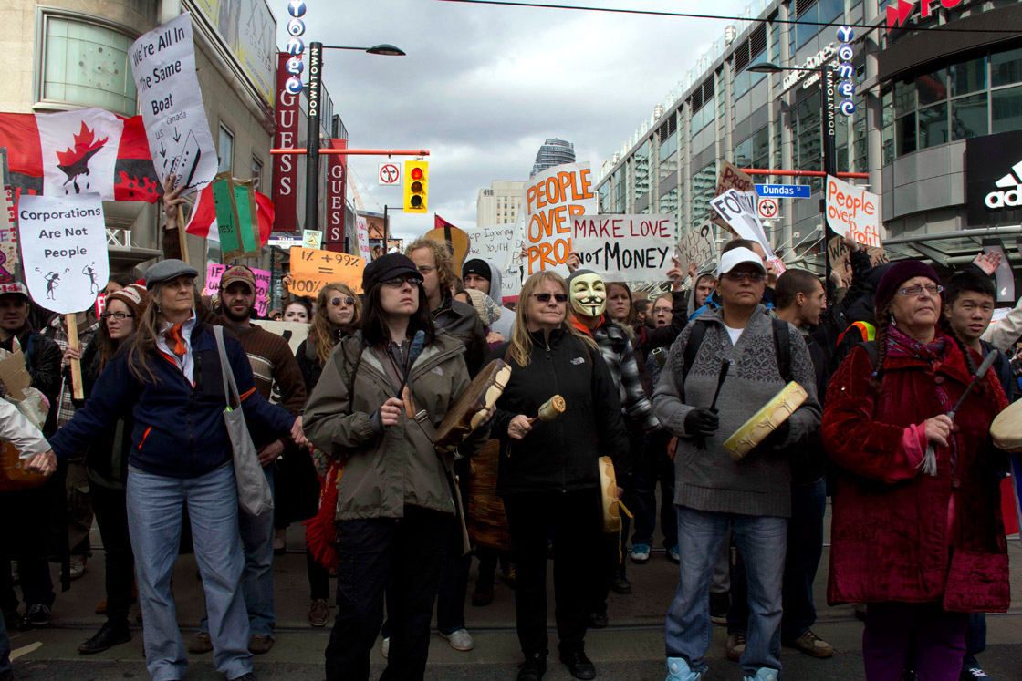 Protesters march down Yonge Street during the third day of the Occupy movement on October 17, 2011 in Toronto, Ontario. 