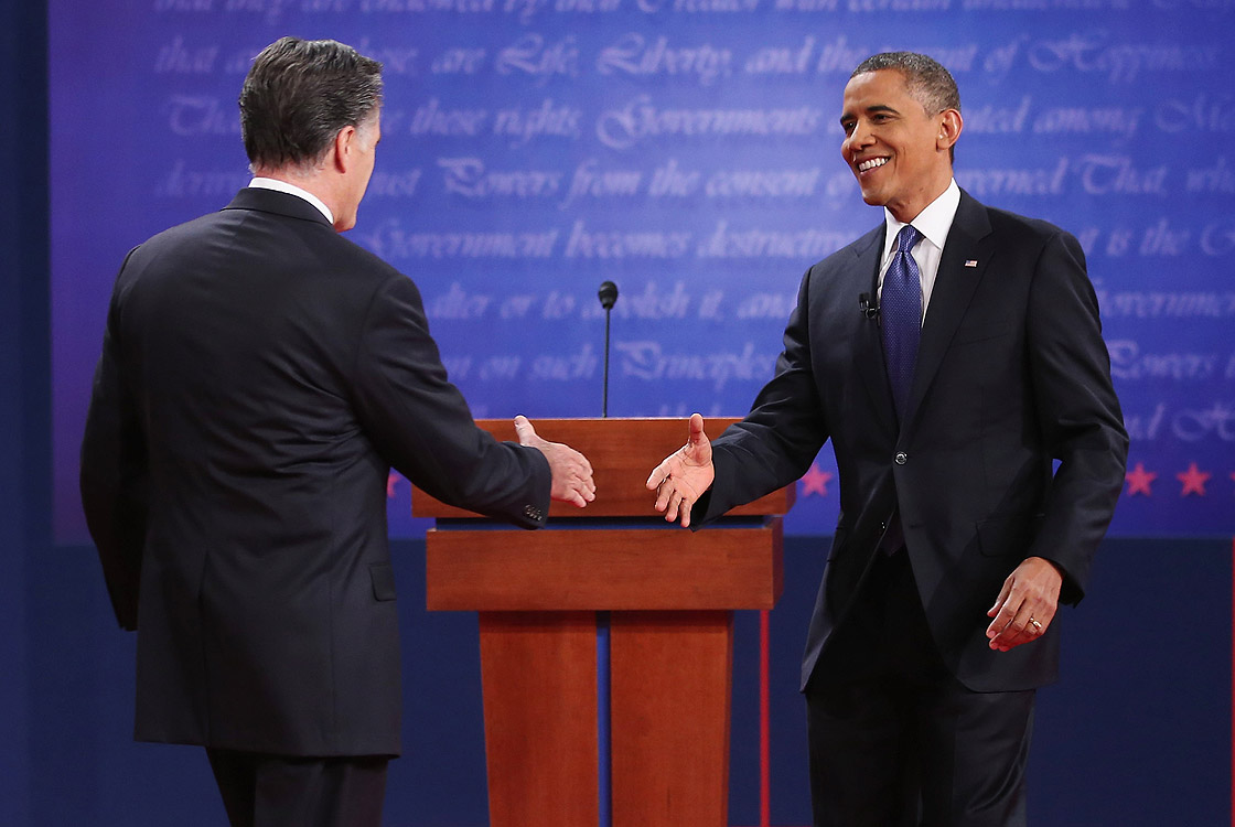 Democratic presidential candidate, U.S. President Barack Obama (R) shakes hands with Republican presidential candidate, former Massachusetts Gov. Mitt Romney (L) after the Presidential Debate at the University of Denver on October 3, 2012 in Denver, Colorado. 