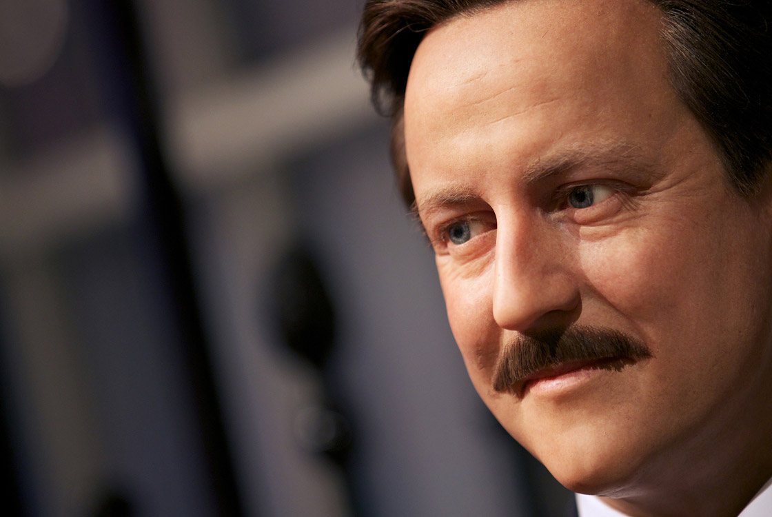 A wax figure of British Prime Minister David Cameron with a moustache is displayed at Madame Tussauds in London on November 7, 2012 in support of Movember. 