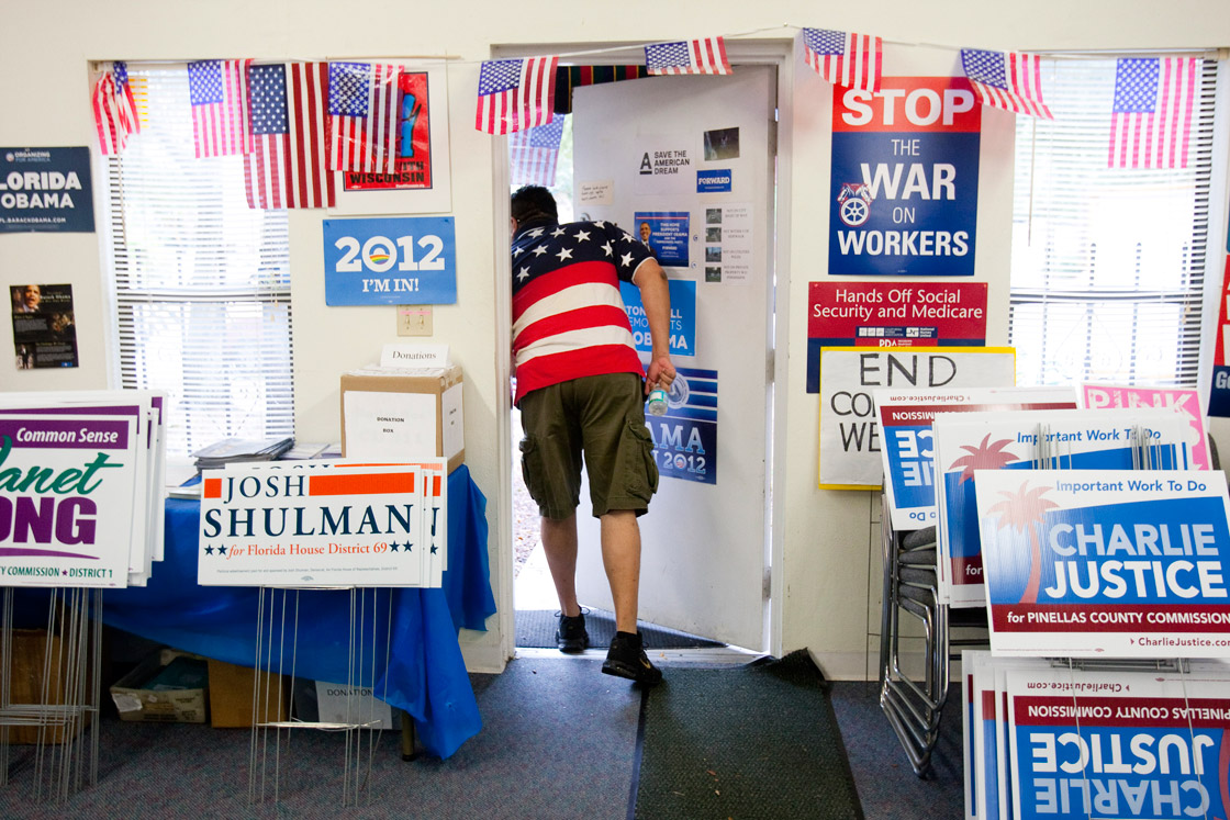 Volunteer David Bowser peeks outside the Pinellas County Democratic Party headquarters November 6, 2012 in St. Petersburg, Florida. Bowser showed up to provide rides to polls for those in need. The swing state of Florida is a hotly-contested battleground that offers 29 electoral votes. 