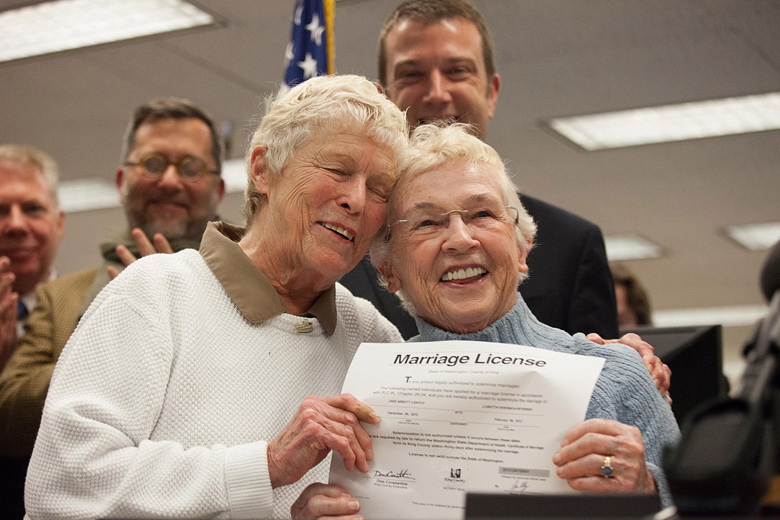 Jane Abbott Lighty, left, and Pete-e Petersen embrace after receiving the first same-sex marriage license in Washington state at the King County Recorder's Office on December 6, 2012 in Seattle, Washington. The office opened at 12:01 AM PST to begin issuing marriage licenses to same-sex couples for the first time after Washington voters chose to legalize same-sex marriage in November's election. 