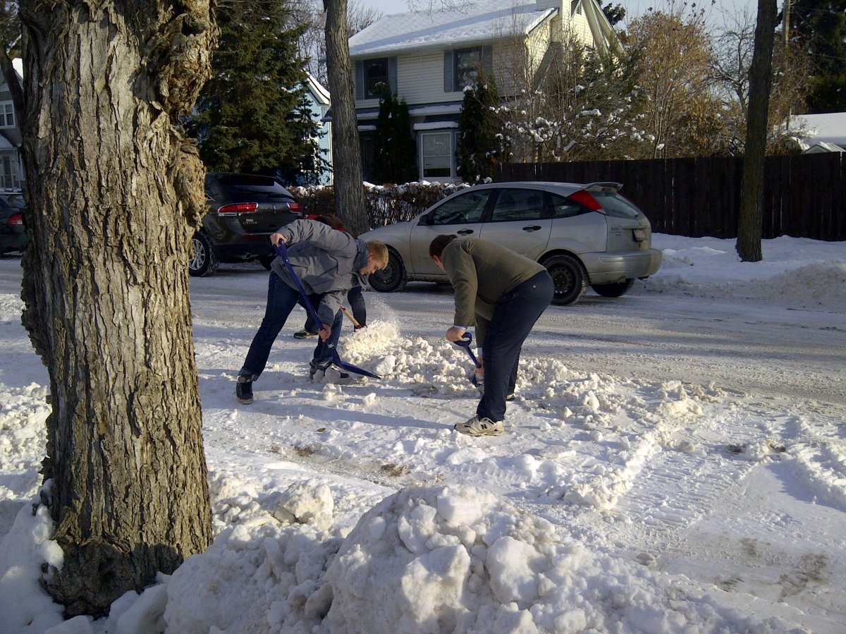 Edmontonians dig out windrows during the winter of 2014.