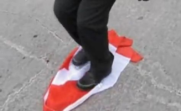 Canadian flag desecrated at a Quebec separatist rally in Montreal - image