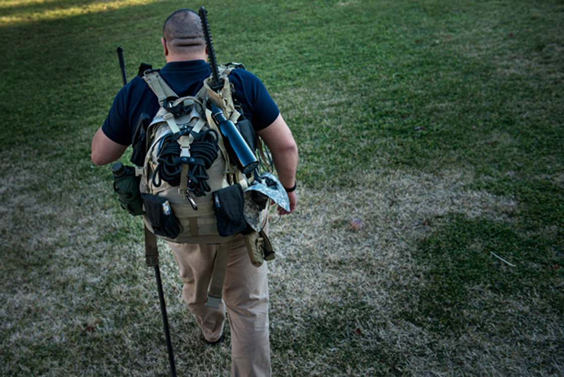 Prepper Jay Blevins walks to his backyard with a bug out bag;a quick grab bag with about 40 pounds of survival gear including a Katana sword on Dec. 5, 2012 in Berryville, Virginia. Jay Blevins and his wife Holly have been preparing with a group of others for a possible doomsday scenario where the group will have to be self sufficient due to catastrophe or civil unrest.