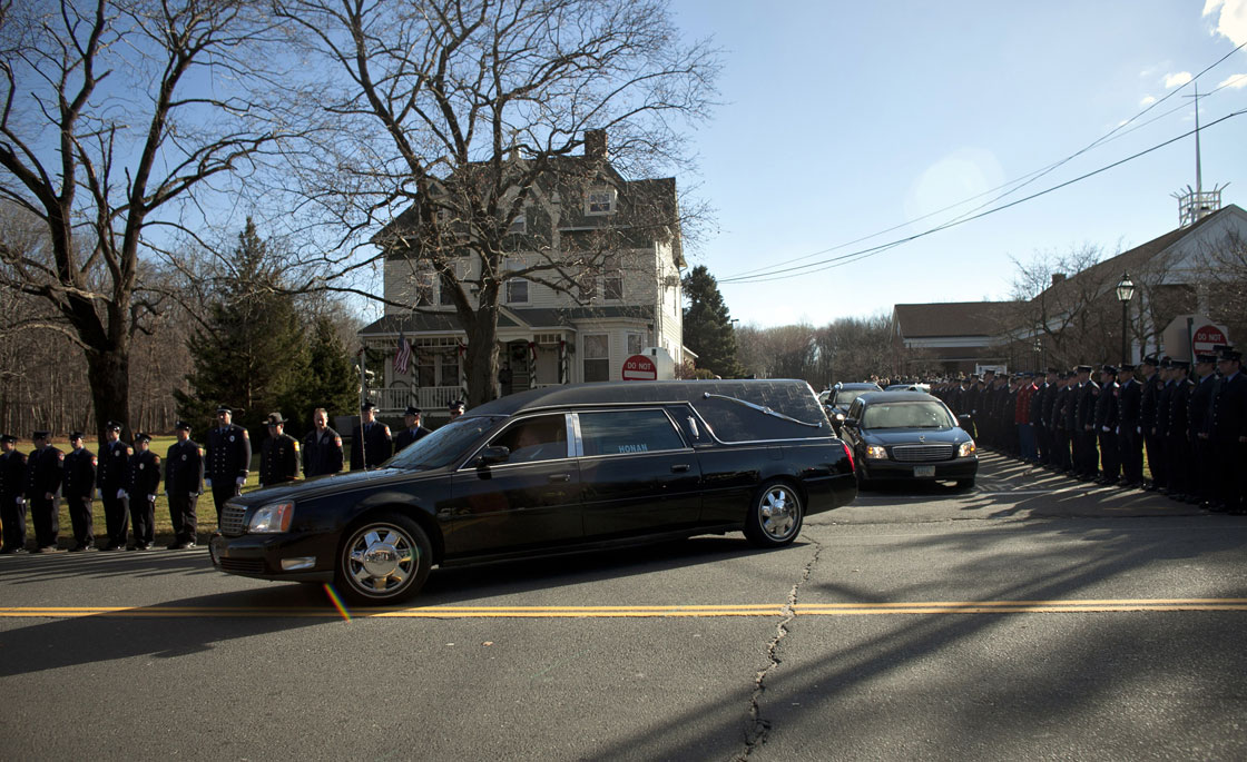 The hearse carrying the casket of Daniel Barden, 7, a victim of the shooting at Sandy Hook Elementary School, leaves St. Rose of Lima Church December 19, 2012 in Newtown, Connecticut. 