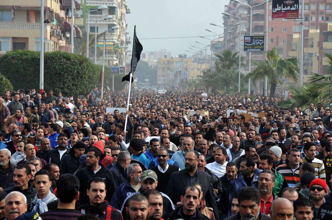 Egyptian mourners march in the canal city of Port Said on January 28, 2013 during the funeral of six people killed in clashes the day before, triggered by death sentences on supporters of a local football team.