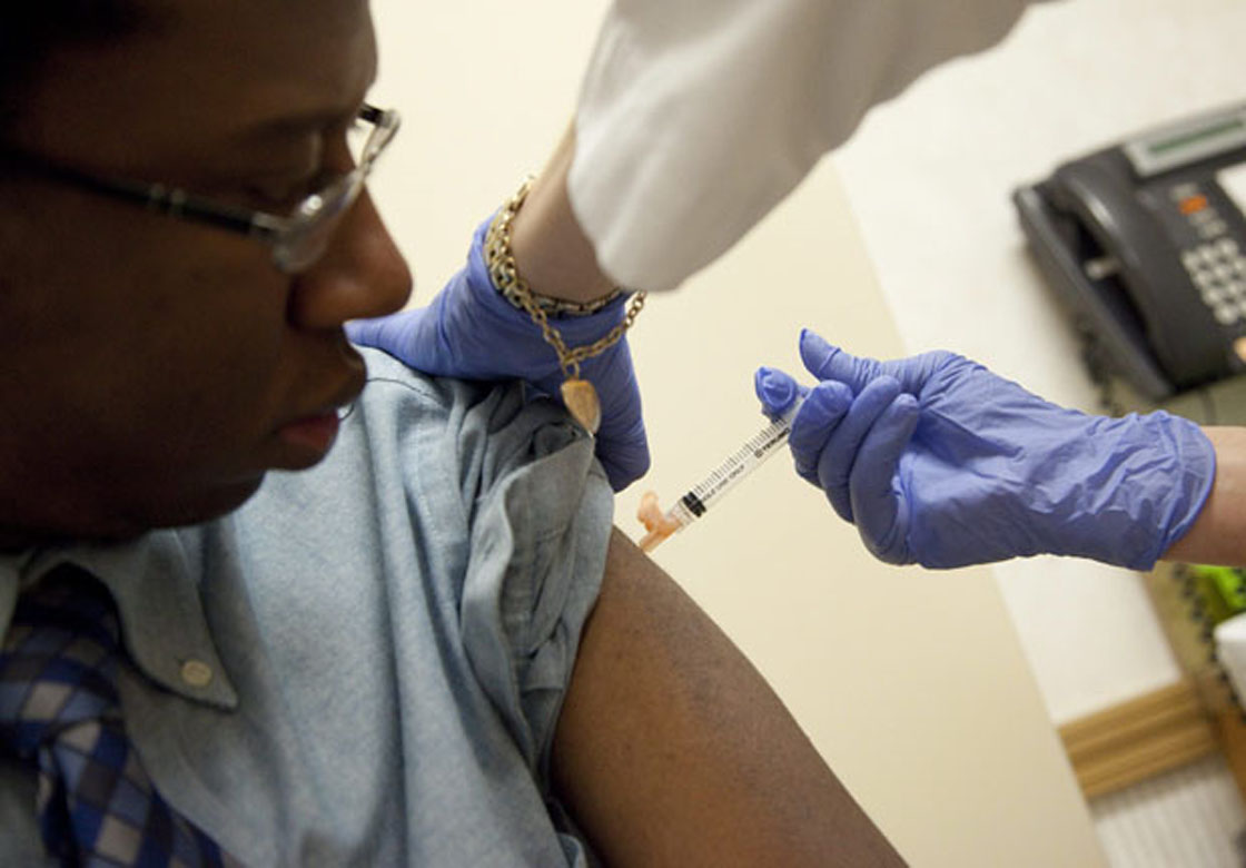 In this file photo, a flu shot is administered.