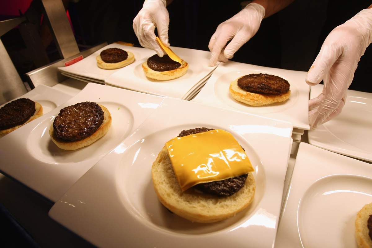 Waitstaff prepare hamburgers at a U.S.election party at the Bertelsmann representation on November 4, 2008 in Berlin, Germany. German media have been following the election closely and most Germans favour Obama.