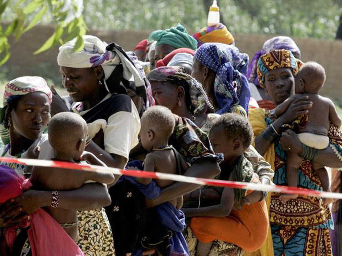 Nigerian mothers with their children queue up at Medecins sans Frontiere (Doctors Without Borders) nutrition center in Dogo village near Zinder;24 August 2005.