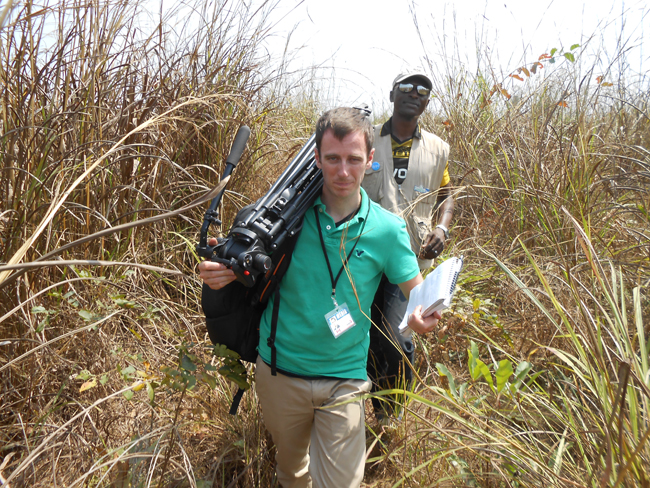 Tom Vernon and Kevin Lamdo (local JHR trainer) hoofing through the forest to the Casava farm in the Port Loko district.