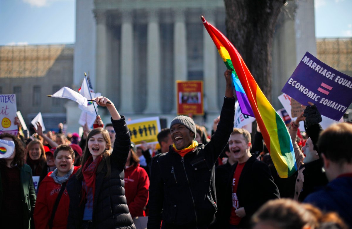 Demonstrators chant outside the Supreme Court in Washington, Tuesday, March 26, 2013, as the court heard arguments on California's voter approved ban on same-sex marriage, Proposition 8. (AP Photo/Pablo Martinez Monsivais).