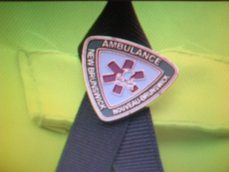 Ambulance New Brunswick paramedics wear black ribbons in memory of Mike Harborne.