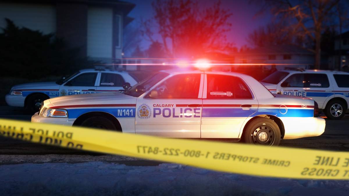 FILE: A photo of a police cruiser and police tape.