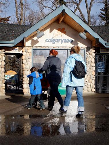 Visitors walk into the Calgary Zoo.