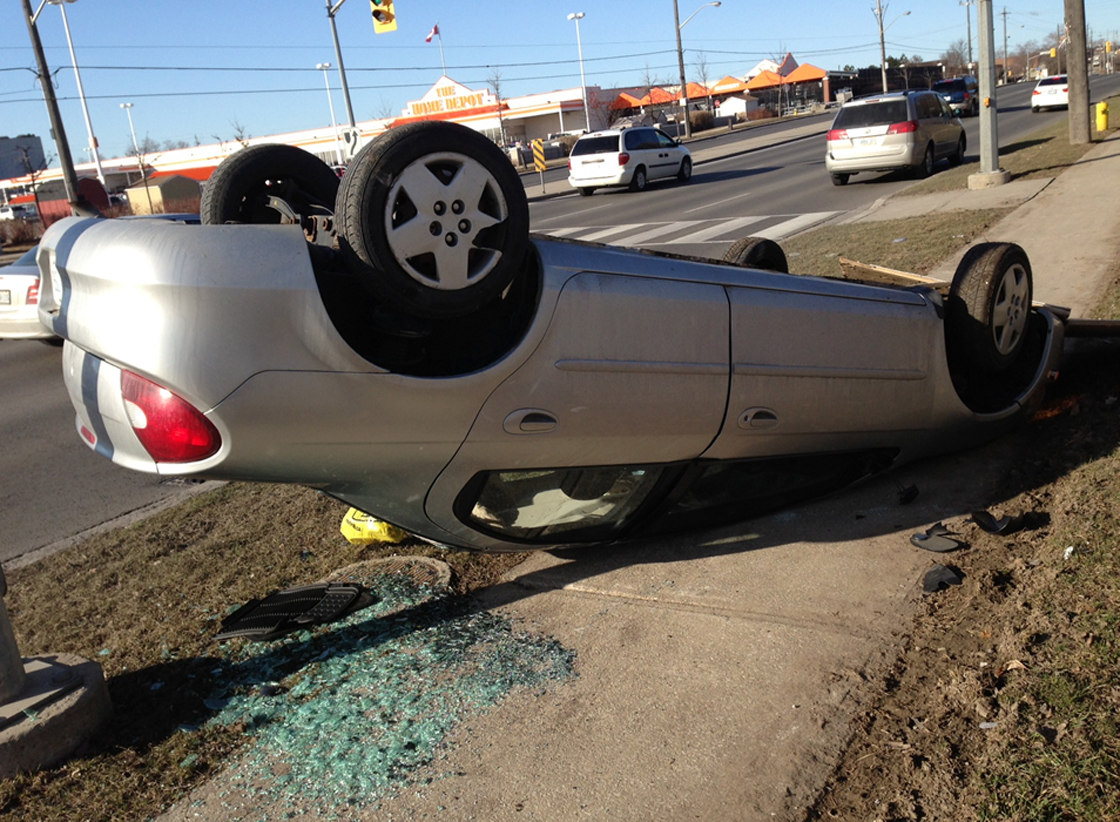 Car drives off parking lot (Toronto, Mar. 30, 2013)