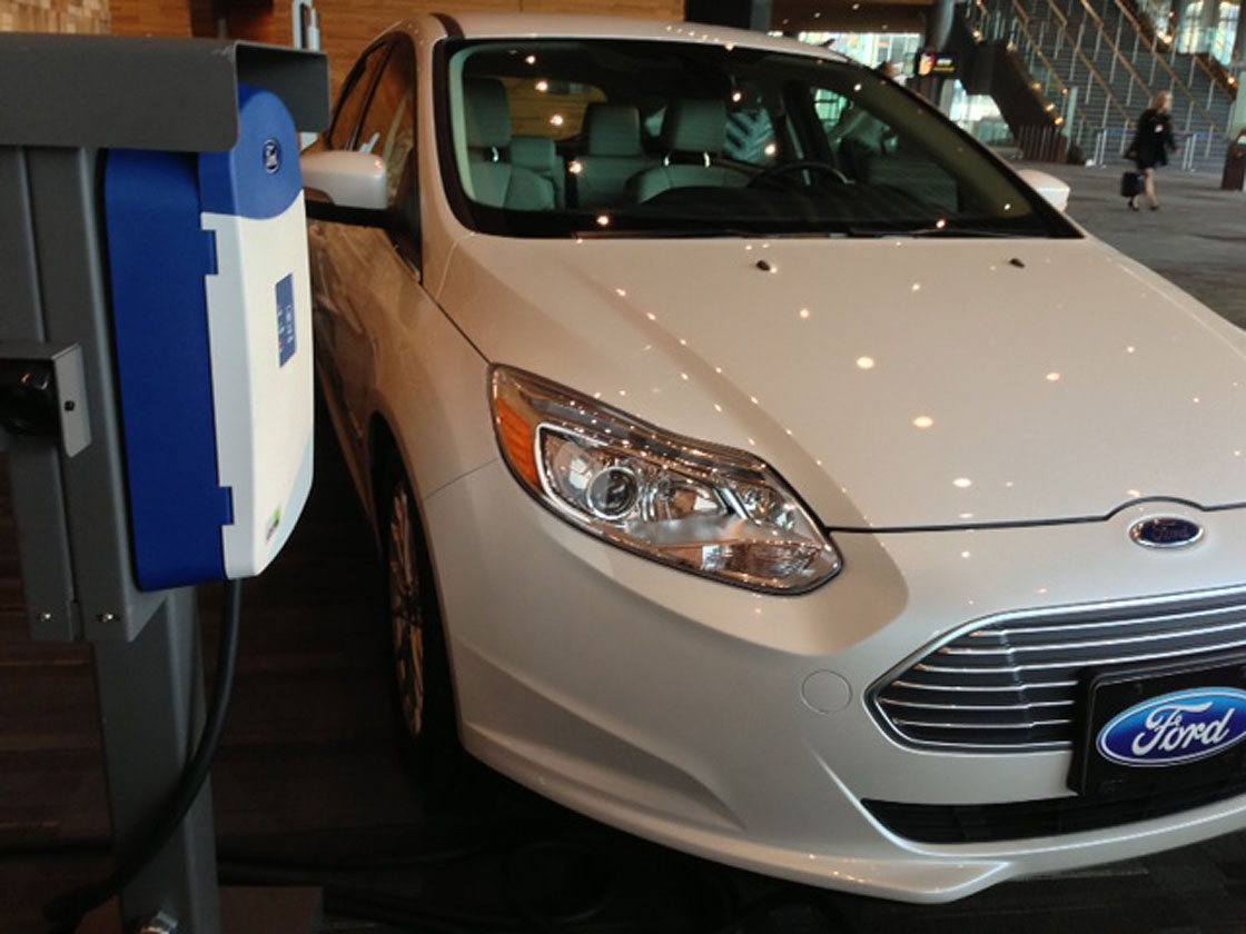 A Ford clean energy vehicle is shown off at a press conference.