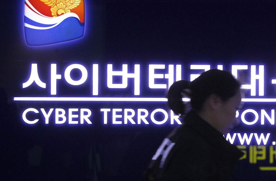 SEOUL, SOUTH KOREA - MARCH 21: A South Korean police officer from Digital Forensic Investigation walks past at Cyber Terror Response Center at National Police Agency on March 21, 2013 in Seoul, South Korea. A cyber attack on the computer networks that run three South Korean banks, two broadcasters and an internet service provider in South Korea yesterday has been traced to an IP address in China, despite many experts suspecting the attacks to originate in North Korea. Officials noted that while the attack was traced to an IP address it China may have originated elsewhere and been routed through the country to disguise the attackers.