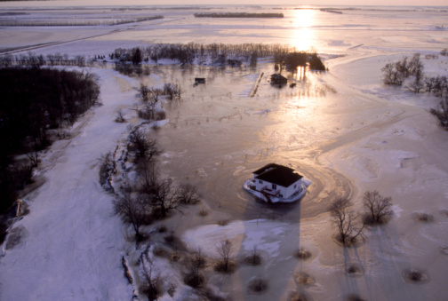 A flooded neighbourhood, once situated along the Red River, fifteen miles south of Fargo, North Dakota.