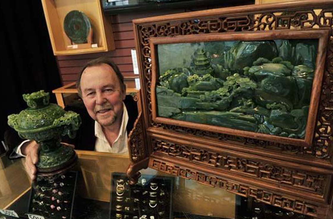 Kirk Makepeace with several of his jade sculptures in Vancouver on March 27, 2013. This is an incense burner from the Polar Mine (on left) and a jade screen by a master Chinese carver from the Ogden Mine.
