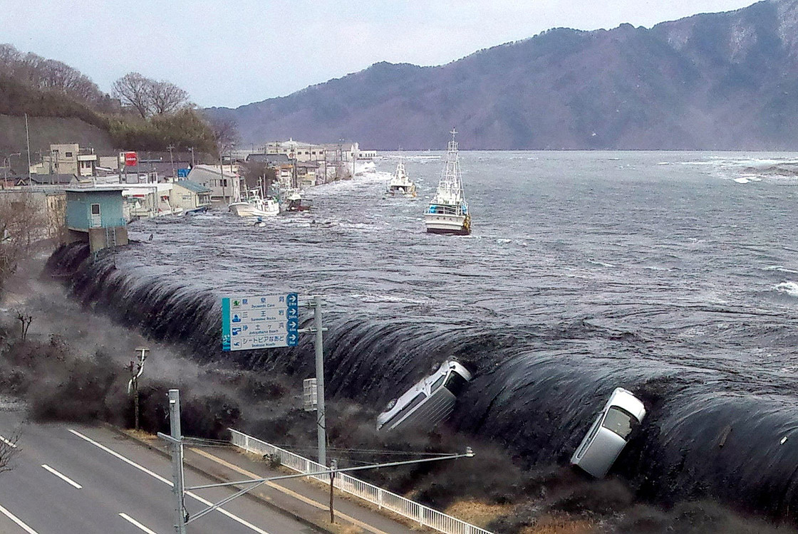 This picture taken by a Miyako City official on March 11, 2011 and released on March 18, 2011 shows a tsunami breeching an embankment and flowing into the city of Miyako in Iwate prefecture shortly after a 9.0 magnitude earthquake hit the region of northern Japan.
