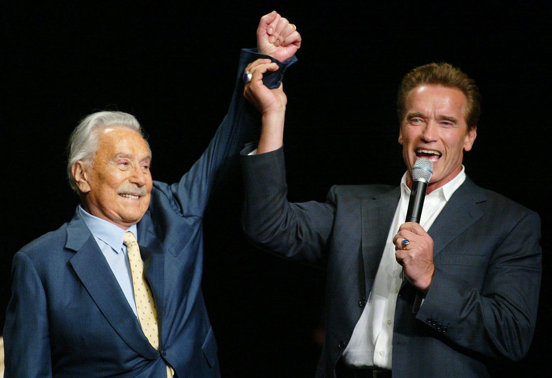 FILE - This Oct. 25, 2003 file photo shows then California Gov. Arnold Schwarzenegger, right, raising the arm of Joe Weider, the creator of Mr. Olympia Bodybuilding competition, during the 39th annual Mr. Olympia event in Las Vegas. Weider, the legendary bodybuilding impresario Arnold Schwarzenegger has often cited as his key mentor, died Friday, March 22, 2013, at age 93.