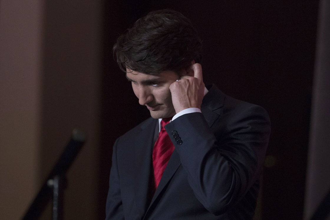 Justin Trudeau takes a seat as he takes part in the Liberal Leadership debate in Mississauga Ont., Saturday, February 16, 2013.