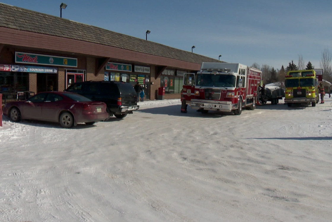 Fire officials say heavy snow on a west-side strip mall caused partial roof collapse Saturday morning.