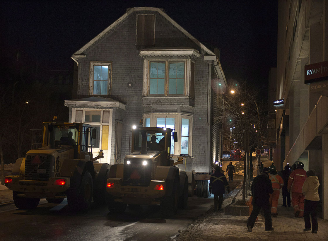 Morris House, believed to be the fourth oldest house in Halifax, is trucked to a new home early on Saturday, Jan. 26, 2013. The 249-year-old building was originally a surveyor's office and is being turned into affordable housing for young adults at a new location.