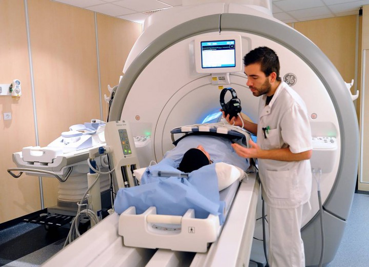 A patient prepares to undergo a MRI (Magnetic resonance imaging, Imagerie par resonance magnetique- IRM in French), on February 6, 2013, at the Oscar Lambret Center in Lille, northern France, a regional medical unit specialised in cancer's treatment.