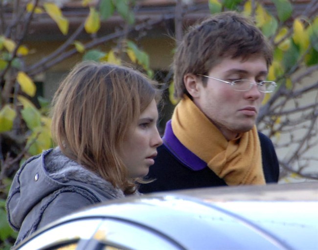 FILE - This Nov. 2, 2007 file photo shows Amanda Marie Knox, of the U.S., left, and her then-boyfriend Raffaele Sollecito, of Italy, outside the rented house where 21-year-old British student Meredith Kercher was found dead in Perugia, Italy. 