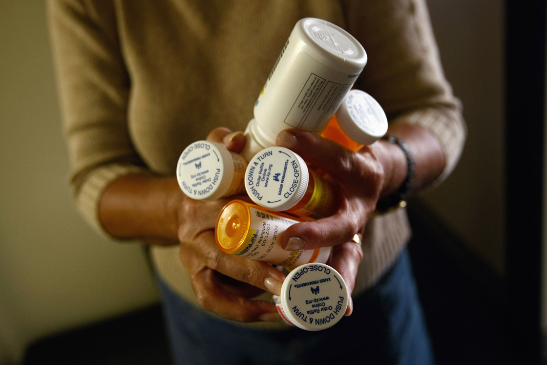 Registered Nurse Susan Eager carries a patient's medications while performing a home visit on November 4, 2009.