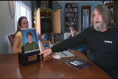 Dan Pippus points to box containing son’s ashes.
