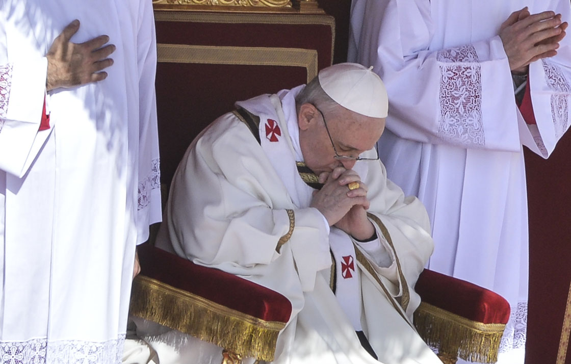 Pope Francis prays during his inauguration mass on March 19, 2013 on St Peter's square at the Vatican. The pope waved to the tens of thousands of pilgrims, who carried flags from around the world and shouted 'Long live the pope!'.