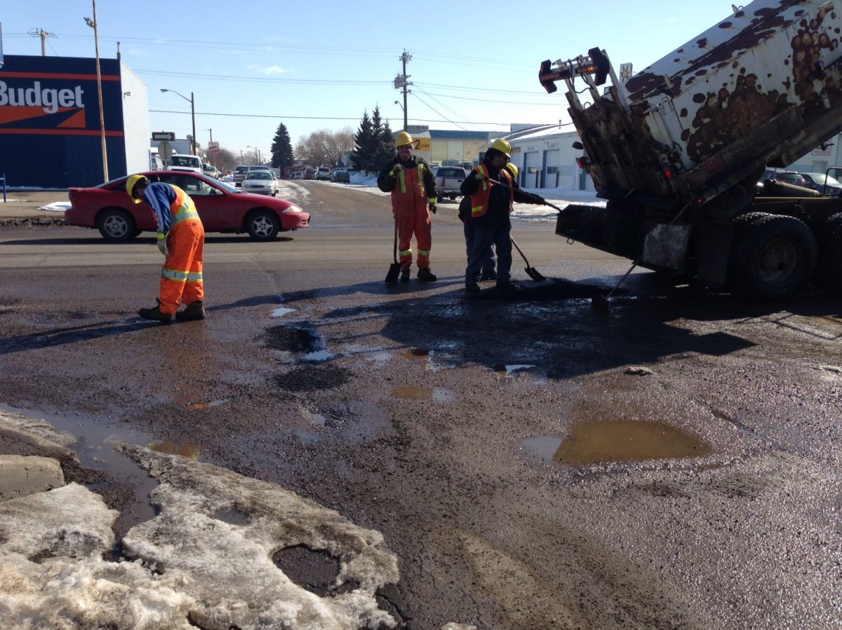 City of Edmonton crew repairing potholes. 