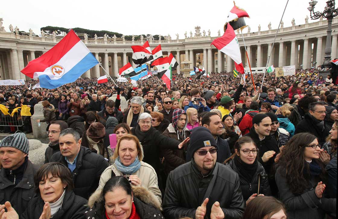 Thousands gather as Pope Francis delivers his Angelus prayer from the window of his studio overlooking St. Peter's Square, at the Vatican. 
