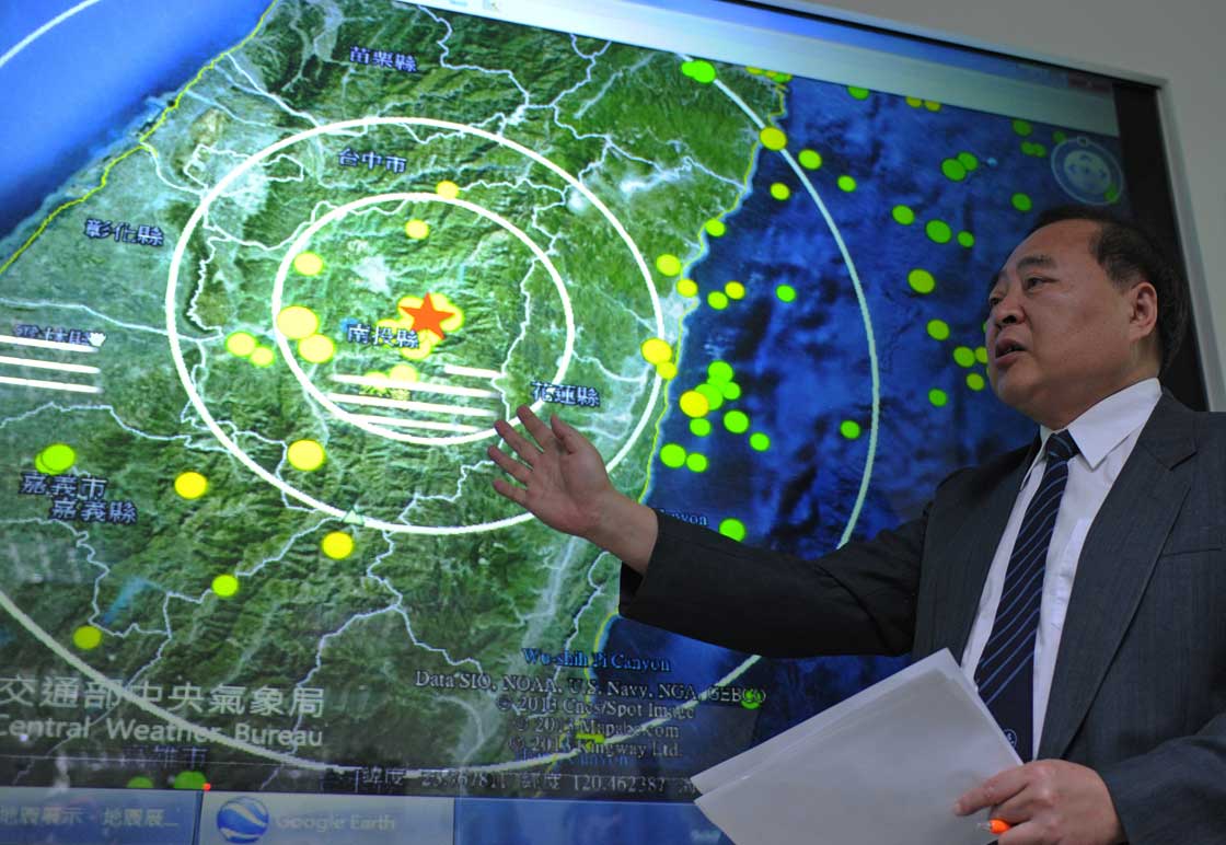 Kuo Kai-wen, director of Seismology Center, speaks to the press at the central Weather Bureau in Taipei on March 27, 2013.  A powerful earthquake measured at 6.0 magnitude by the U.S. Geological Survey shook buildings in Taipei, injuring at least four people and causing one fire.  