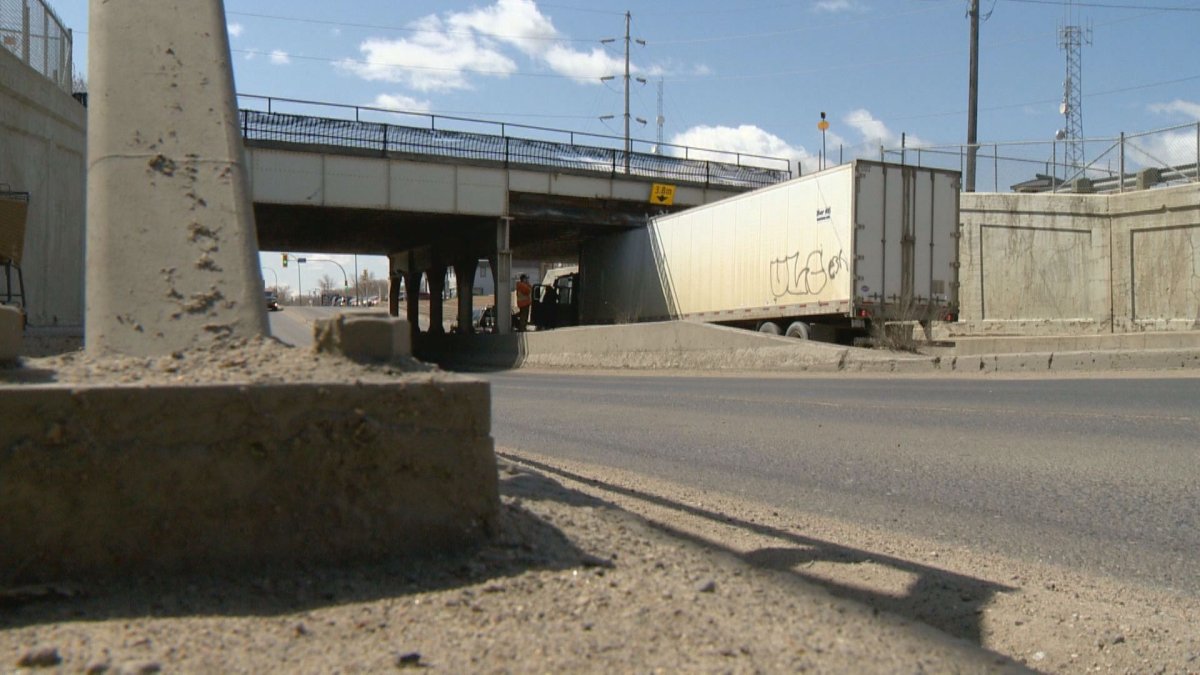 The CP Rail overpass on Winnipeg Street bears the scars of many a collision. Semis routinely fail to make it under, despite signs clearly marking the maximum ground clearance of 3.8 meters.