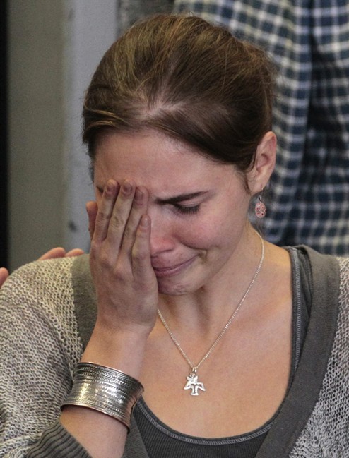 FILE - In this Tuesday, Oct. 4, 2011 file photo Amanda Knox becomes emotional as she sits down for a news conference shortly after her arrival at Seattle-Tacoma International Airport , in Seattle.