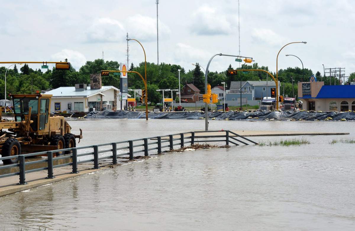 An intersection of highways 39 and 35 in Weyburn sits completely submerged in southeast Saskatchewan on Monday, June 20, 2011. 