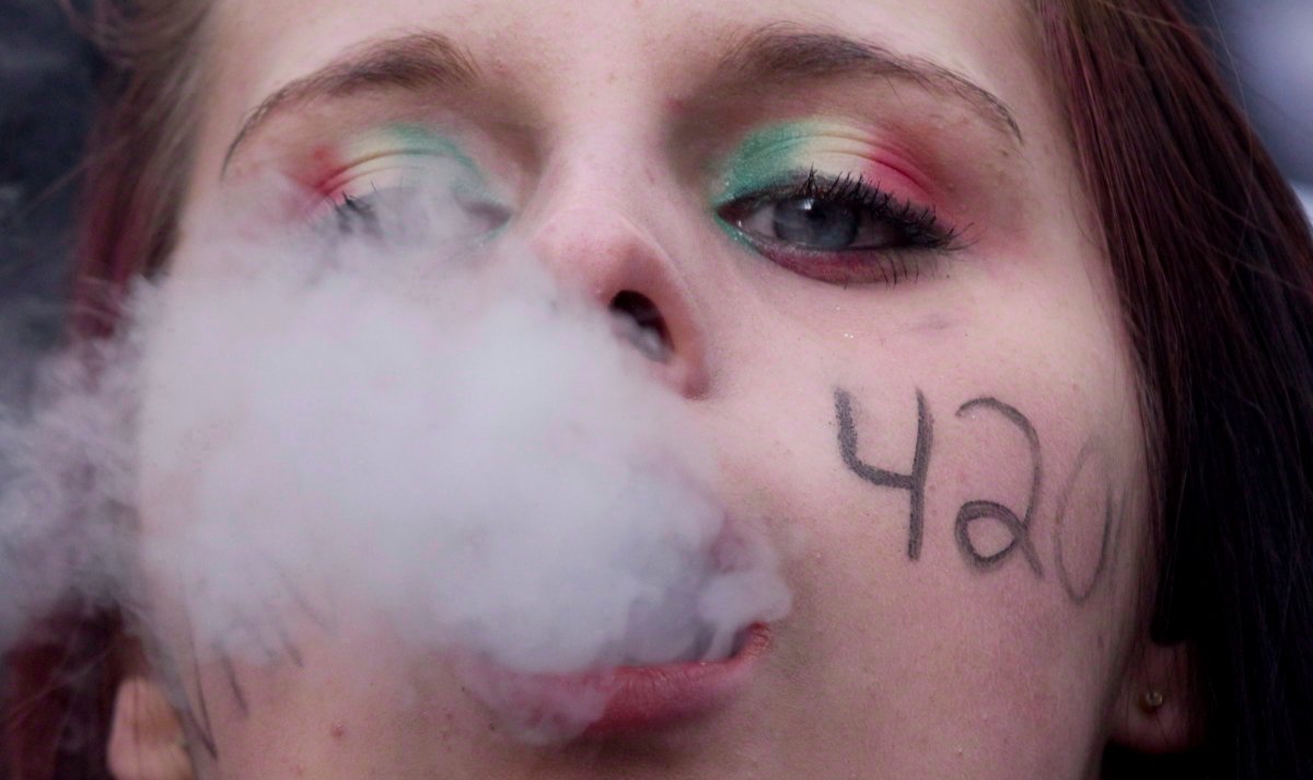 FILE PHOTO: A demonstrator exhales marijuana smoke during the 4/20 protest in Vancouver, B.C. Friday, April, 20, 2012. THE CANADIAN PRESS/Jonathan Hayward.