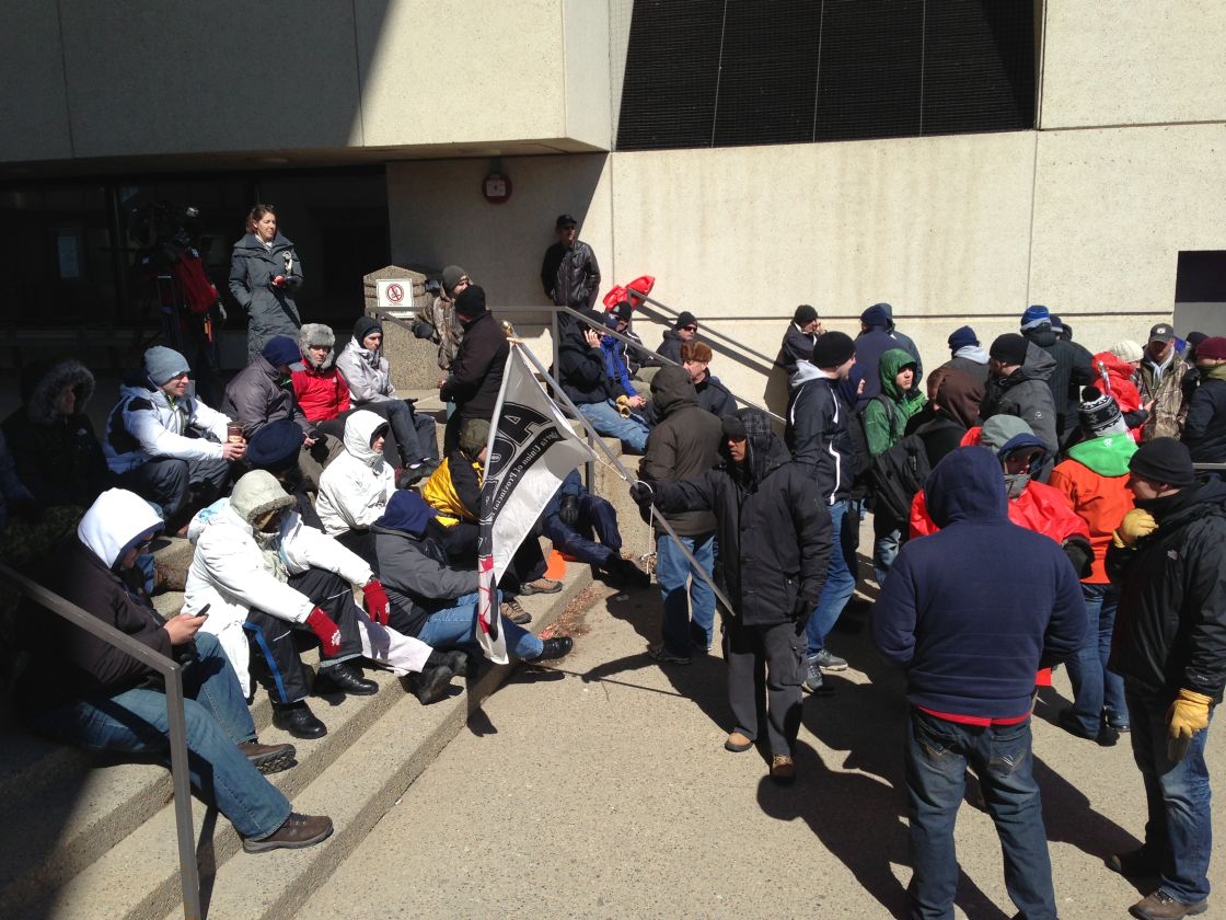 Alberta workers remain on strike outside the law courts in Edmonton, Tuesday, April 30, 2013.
